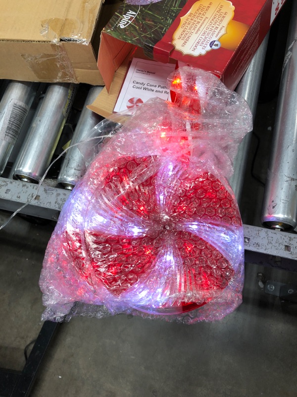 Photo 2 of Alpine Corporation 28" H Outdoor Candy Cane Yard Stakes with Red and White LED Lights (Set of 3)