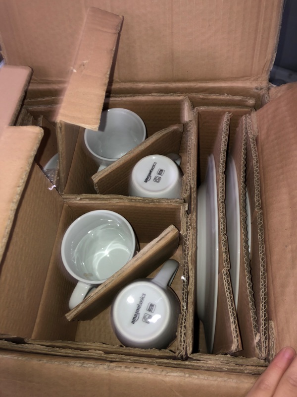Photo 1 of Amazon Basics 16-Piece Porcelain Kitchen Dinnerware Set with Plates, Bowls and Mugs, Service for 4 - White