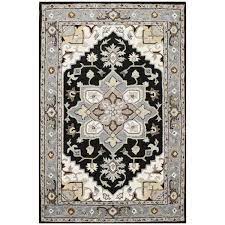 Photo 1 of Agra Collection Heriz Design 5 ft. x 8 ft. Indoor Handmade Wool Area Rug, 5 ft. x 7 ft. 6 in., Charcoal Gray/Black
