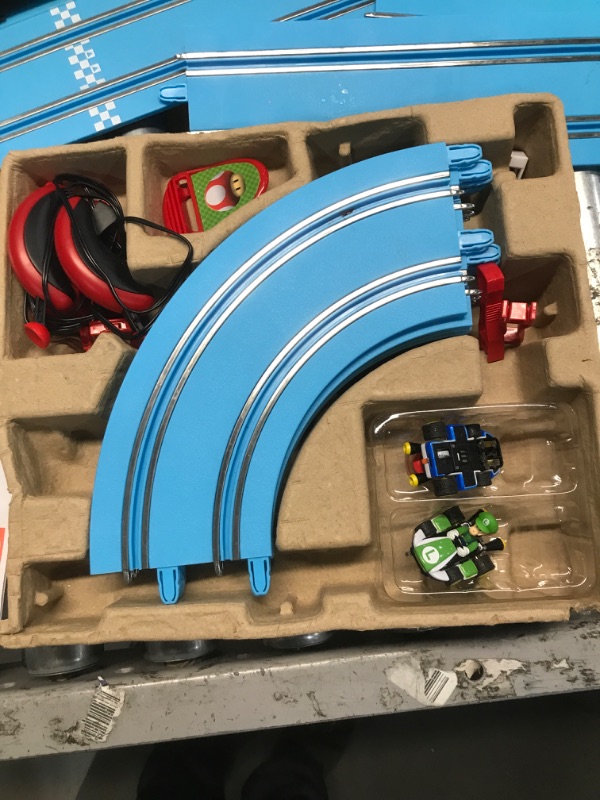 Photo 2 of Carrera First Nintendo Mario Kart Slot Car Race Track - Includes 2 Cars: Mario and Luigi and Two-Controllers - Battery-Powered Beginner Set for Kids Ages 3 Years and Up, 20063028 Mario Kart / Flippers