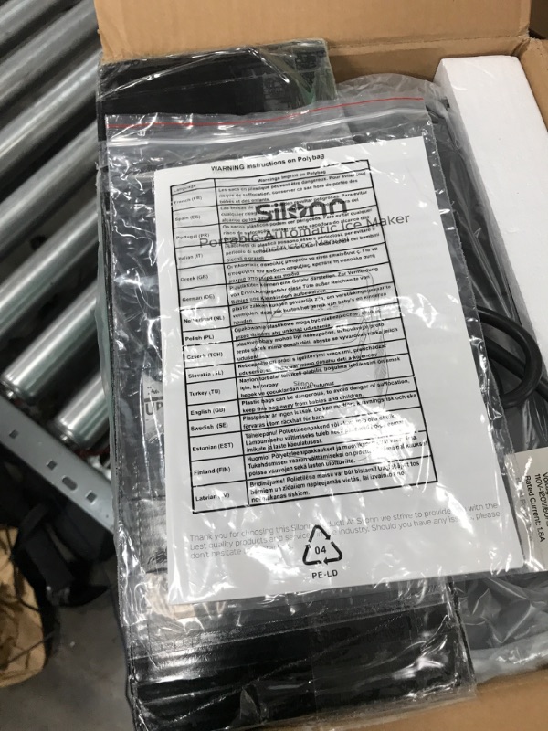 Photo 1 of **TURNS ON**Silonn Self-Cleaning Ice Maker with Ice Scoop and Basket Black Ice Maker, Makes up to 27 lbs. of Ice Per Day, 9 Cubes in 7 Mins