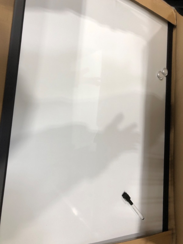 Photo 2 of Used / minor damaged ** Amazon Basics Magnetic Dry Erase White Board, 35 x 23-Inch Whiteboard - Black Wooden Frame 23"x35" Magnetic, Wood Frame