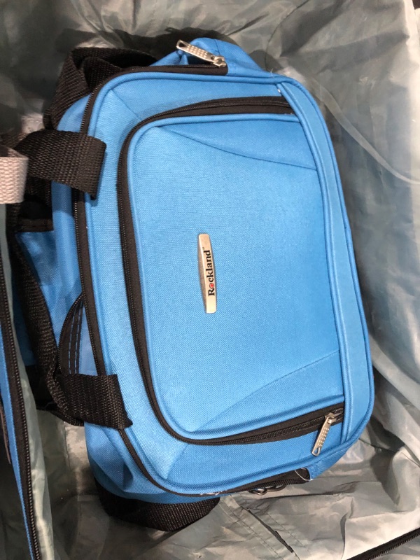 Photo 14 of **KEYS ARE IN POCKET TO LARGER SUITCASE, BRAND TAG IS FALLING OFF. SEE PHOTOS**
Rockland Journey Softside Upright Luggage Set, Blue, 4-Piece (14/19/24/28) 4-Piece Set (14/19/24/28) Blue
