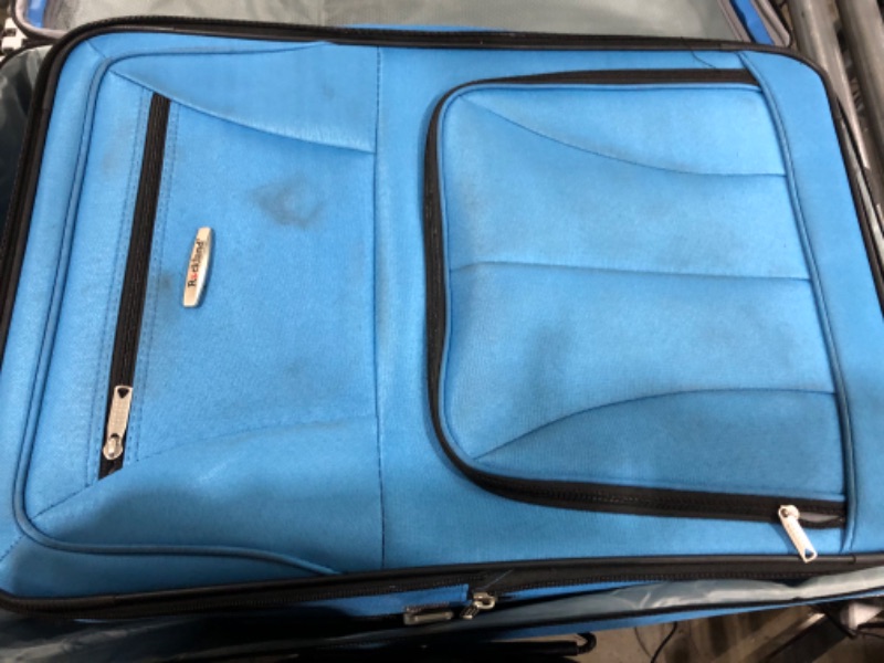 Photo 7 of **KEYS ARE IN POCKET TO LARGER SUITCASE, BRAND TAG IS FALLING OFF. SEE PHOTOS**
Rockland Journey Softside Upright Luggage Set, Blue, 4-Piece (14/19/24/28) 4-Piece Set (14/19/24/28) Blue