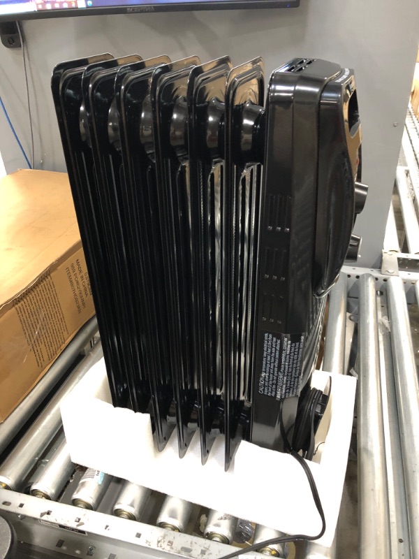 Photo 2 of Amazon Basics Indoor Portable Radiator Heater - Black Black Heater