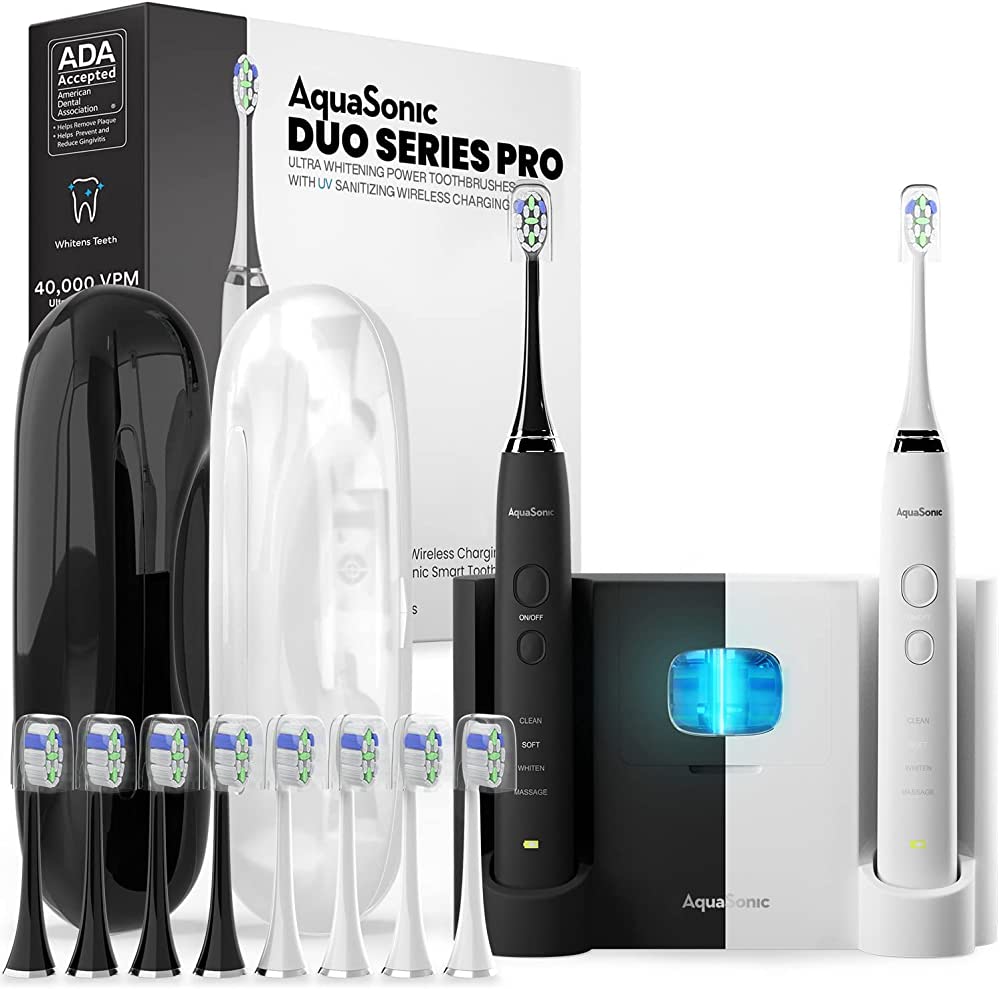 Photo 1 of AquaSonic DUO PRO – Ultra Whitening 40,000 VPM Electric Smart ToothBrushes – ADA Accepted - 4 Modes with Smart Timers - UV Sanitizing & Wireless Charging Base - 10 ProFlex Brush Heads & 2 Travel Cases