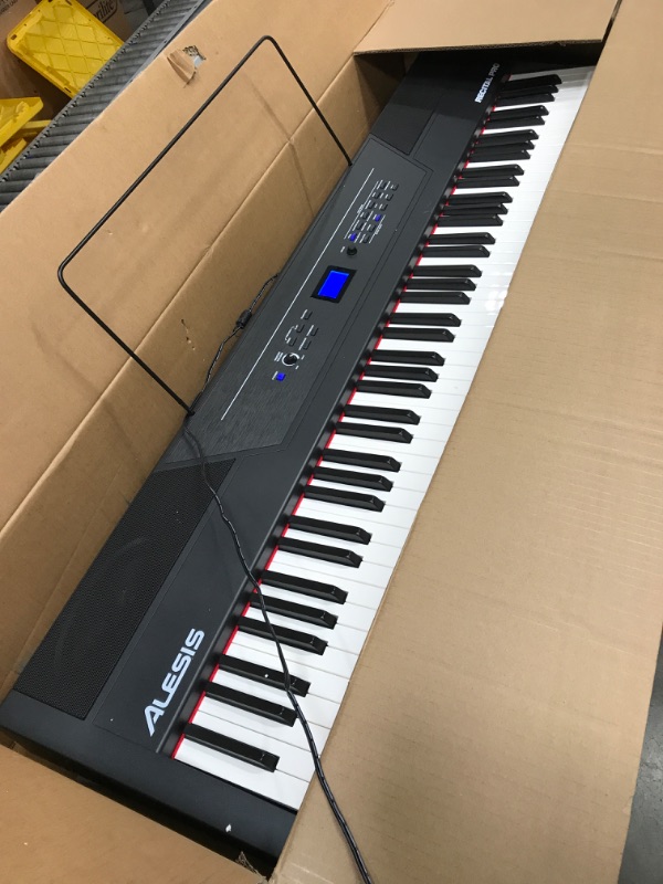 Photo 2 of Alesis Recital Pro - 88 Key Digital Piano Keyboard with Hammer Action Weighted Keys, 2x20W Speakers, 12 Voices, Record and Lesson Mode, FX and Display
