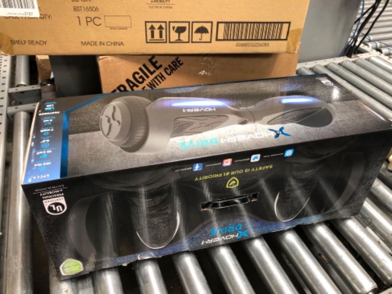 Photo 1 of Hover-1 Drive Electric Hoverboard | 7MPH Top Speed, 3 Mile Range, Long Lasting Lithium-Ion Battery, 6HR Full-Charge, Path Illuminating LED Lights Black
