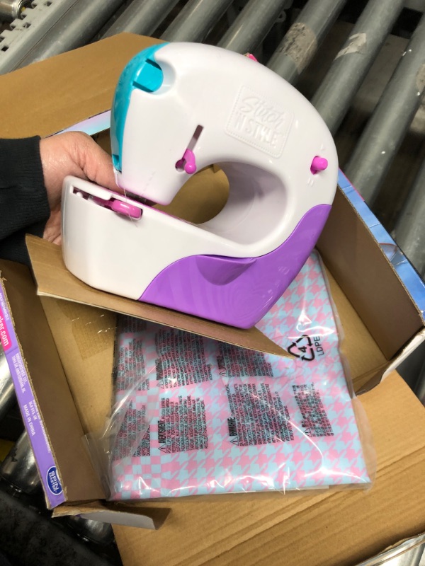 Photo 1 of Cool Maker, Stitch ‘N Style Fashion Studio, Pre-Threaded Sewing Machine Toy with Fabric and Water Transfer Prints, Arts & Crafts Kids Toys for Girls