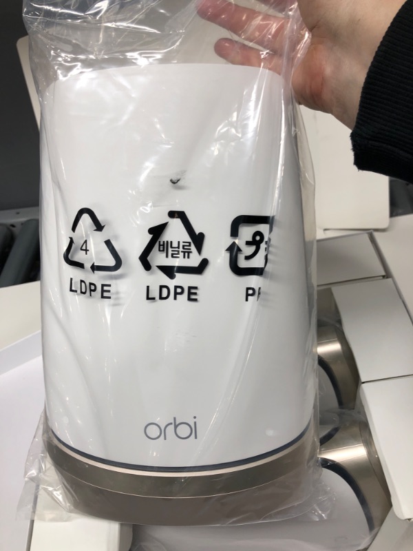 Photo 3 of ***OPENED, APPEARS OTHERWISE NEW*** NETGEAR Orbi Quad-Band WiFi 6E Mesh System (RBKE963), Router with 2 Satellite Extenders, Coverage up to 9,000 sq. ft, 200 Devices, 10 Gig Internet Port, AXE11000 802.11 Axe (Up to 10.8Gbps) WiFi 6E | 3-Pack