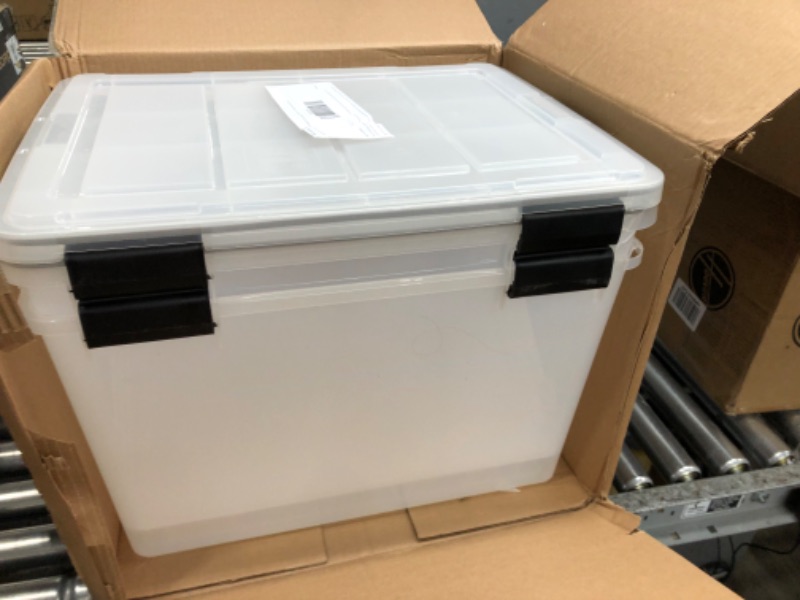 Photo 3 of **damage to corners**
IRIS USA 74 Quart WEATHERPRO Plastic Storage Box with Durable Lid and Seal and Secure Latching Buckles, Weathertight, Clear with Black Buckles, 2 Pack 74 Qt. -2 Pack