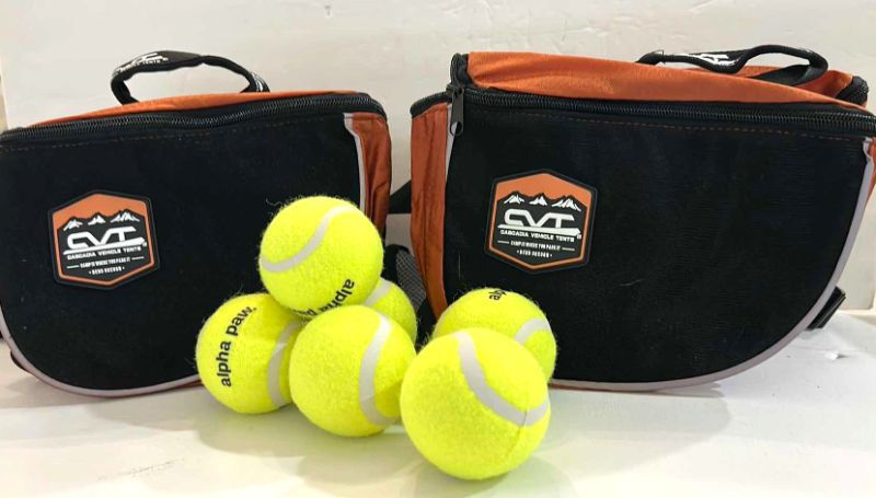 Photo 1 of NEW DOG ASSORTMENT- 2 SMALL CVT BACKPACKS/SADDLE BAGS AND 6 ALPHA PAWS TENNIS BALLS  $60