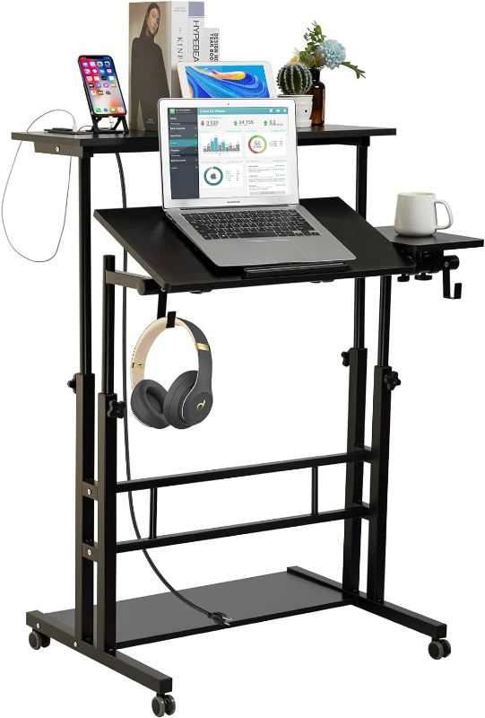 Photo 1 of SIDUCAL Mobile Stand Up Desk, Adjustable Laptop Desk with Wheels, Storage Desk Home Office Workstation with USB Ports and Outlets, Rolling Table Laptop Cart for Standing or Sitting, Black
