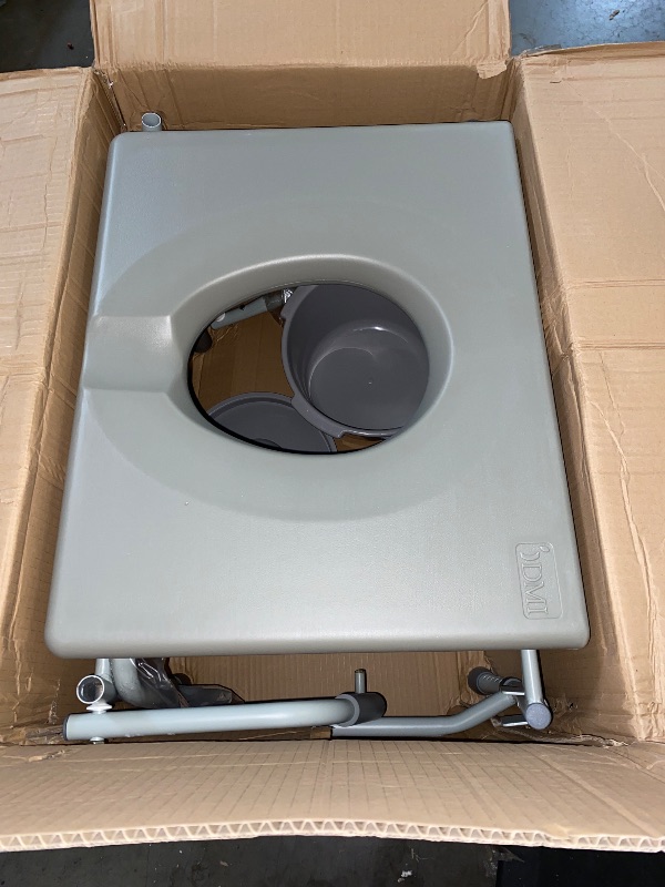 Photo 1 of DMI Bedside Commode, Portable Toilet, Commode Chair, Raised Toilet Seat with Handles, Holds up to 500 Pounds with Included 7 qt Commode Bucket, Adjustable from 19-23 Inches, Extra Wide Commode