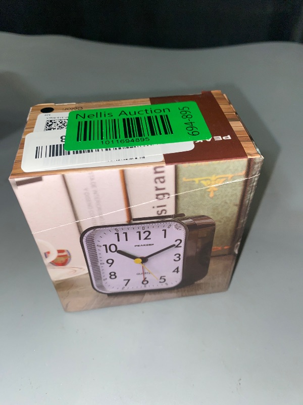 Photo 1 of Peakeep Small Battery Operated Analog Travel Alarm Clock Silent No Ticking, Lighted on Demand and Snooze, Beep Sounds, Gentle Wake, Ascending Alarm, Easy Set (Black)