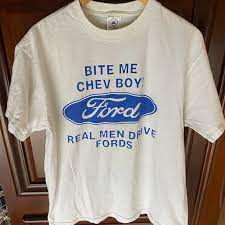 Photo 1 of "Real Men Drive Fords" Men's T-Shirt - Green w/Blue & White Logo **STOCK PHOTO TO SHOW STYLE, COLORS ARE DIFFERENT, SEE PHOTOS**