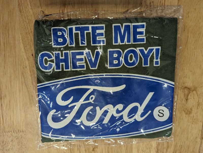 Photo 2 of "Real Men Drive Fords" Men's T-Shirt - Green w/Blue & White Logo **STOCK PHOTO TO SHOW STYLE, COLORS ARE DIFFERENT, SEE PHOTOS**