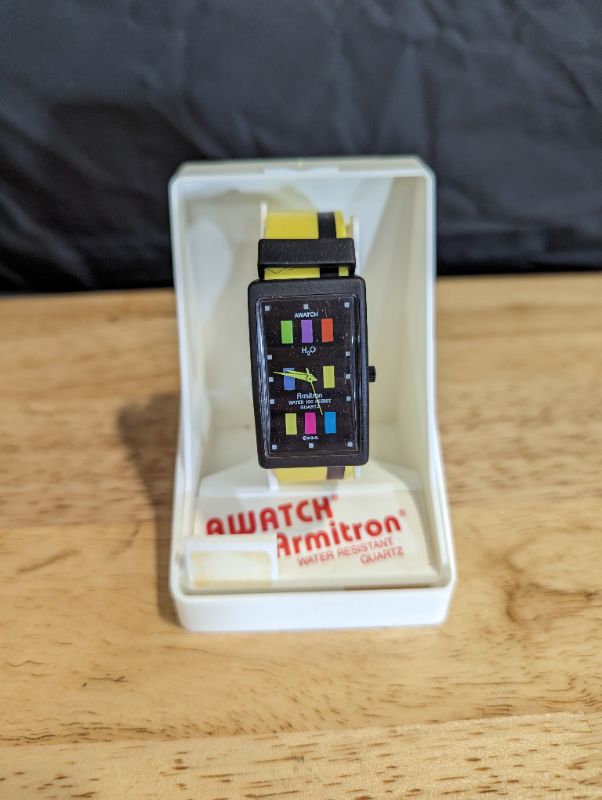 Photo 1 of Awatch by Armitron - Water Resistant Quartz - Yellow Band w/Black Stripe 