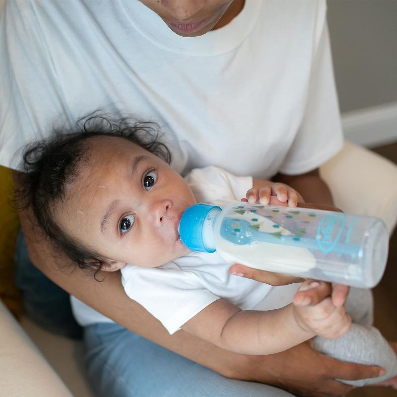 Photo 3 of Dr. Brown’s Natural Flow® Anti-Colic Options+™ Narrow Baby Bottles 8 oz/250 mL, with Level 1 Slow Flow Nipple, 4 Pack, Blue Nature & Triceratops Lovey with HappyPaci Pacifier, 0m+- MINOR DAMAGE
