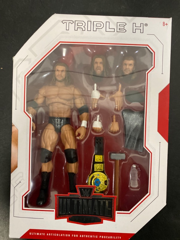 Photo 2 of WWE Triple H Ultimate Edition Wave 3 Multiple-Pose 6-inch Action Figure with Entrance Gear, Extra Heads & Swappable Hands ?
