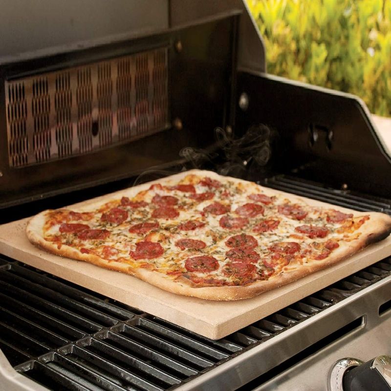 Photo 1 of COYMOS Pizza Stone Heavy Duty Ceramic Baking Stone for use in Oven & Gril - Thermal Shock Resistant, Ideal for Baking Pizza, Bread, Cookies, Rectangular Cooking Stone 15x12 Inch. (Bonus Free Scraper)