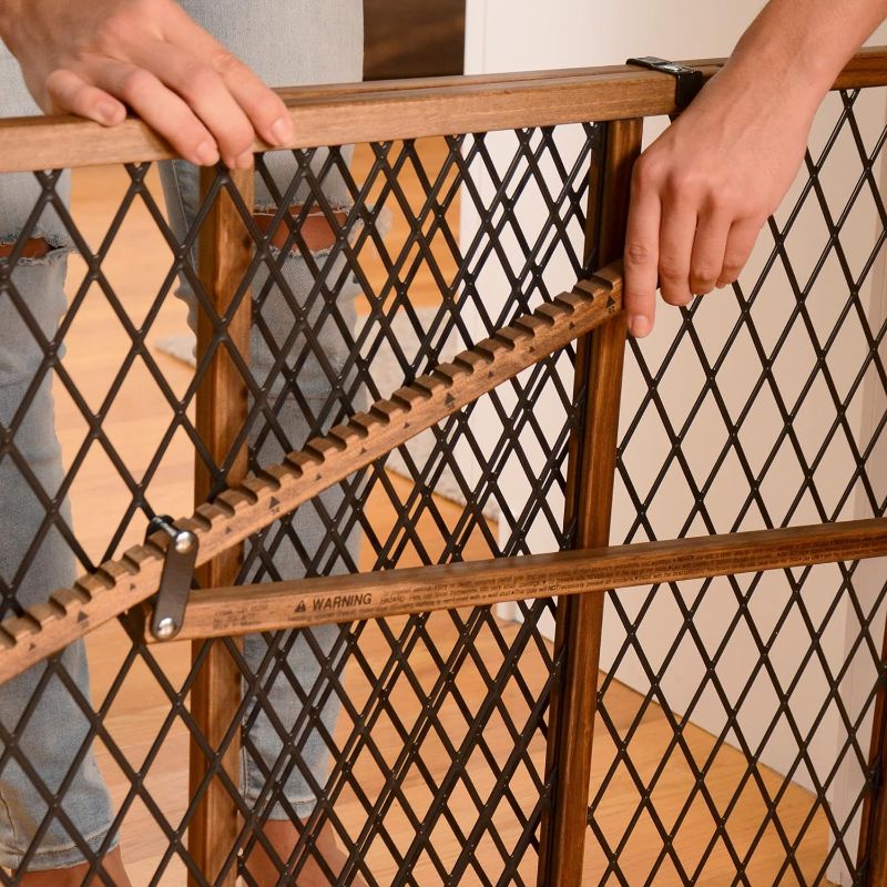 Photo 2 of Simple to Install: The Pressure Mount Gate Allows Quick and Easy Installation and Re-Installation
Neutral Styling: The warm wood and black mesh accents fit seemlessly into the farmhouse look, making this gate part of your home décor
Versatile: With an Ext