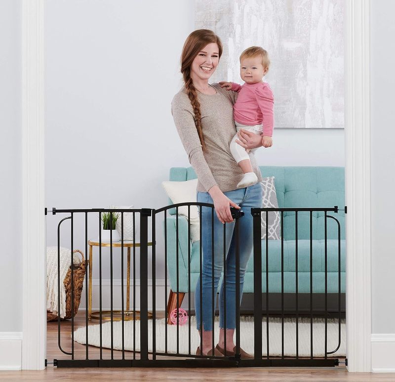 Photo 1 of Regalo 58-Inch Home Accents Super Wide Walk Through Baby Gate, Includes 6-Inch, 8-Inch and 12-Inch Extension, 4 Pack of Pressure Mounts and 4 Pack of Wall Cups and Mounting Kit