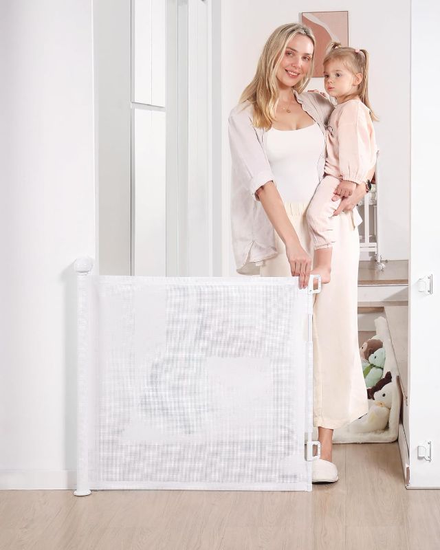 Photo 1 of Retractable Baby Gate, Mesh Baby and Pet Gate 33" Tall, Extends up to 55" Wide, Child Safety Baby Gates for Stairs Doorways Hallways, Dog Gate Cat Gate for Indoor and Outdoor (White)