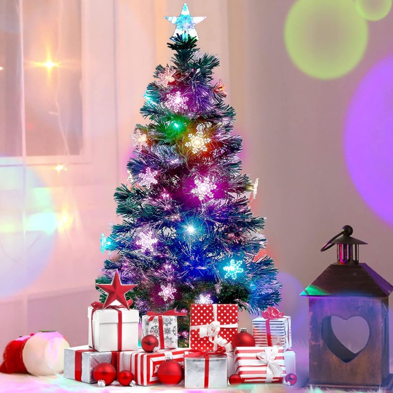 Photo 1 of Juegoal 4 ft Pre-Lit Artificial Christmas Tree, Lighted Optical Fiber Xmas Trees with RGB Color Changing LED Lights, Snowflakes & Top Star, Festive Party Holiday Fake Multicolored Tree with Metal Legs
