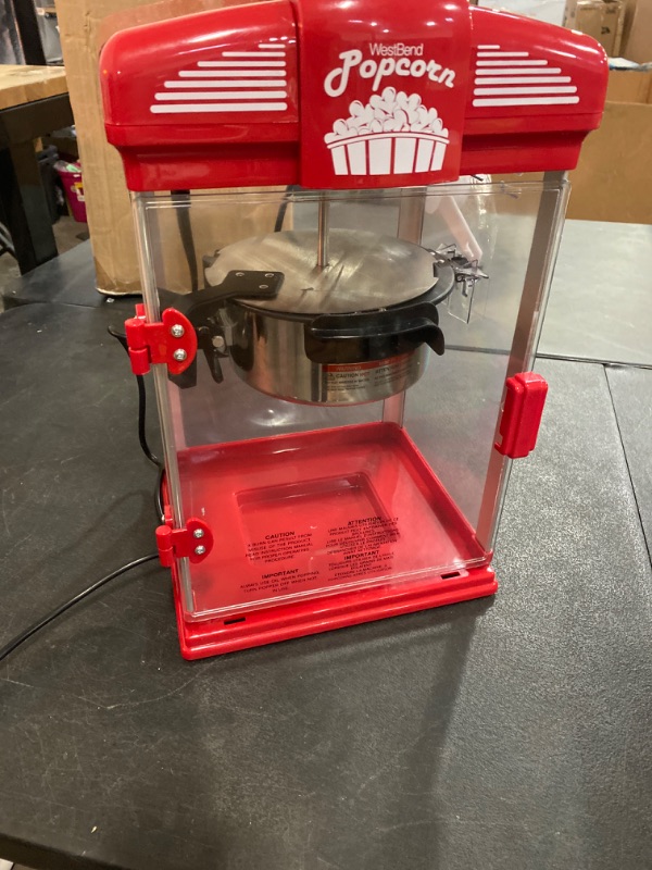 Photo 1 of West Bend Stir Crazy Movie Theater Popcorn Popper with Nonstick Popcorn Kettle, Measuring Tool and Popcorn Scoop for Gourmet Popcorn Machine , 4 Qt., Red
