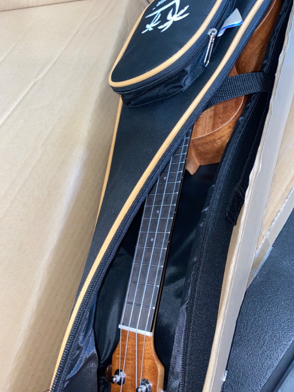 Photo 2 of Donner Concert Ukulele Beginner Mahogany 23 Inch Ukelele Kit with Free Online Lesson Gig Bag Strap Nylon String Tuner Picks Cloth DUC-1 Gift Choice