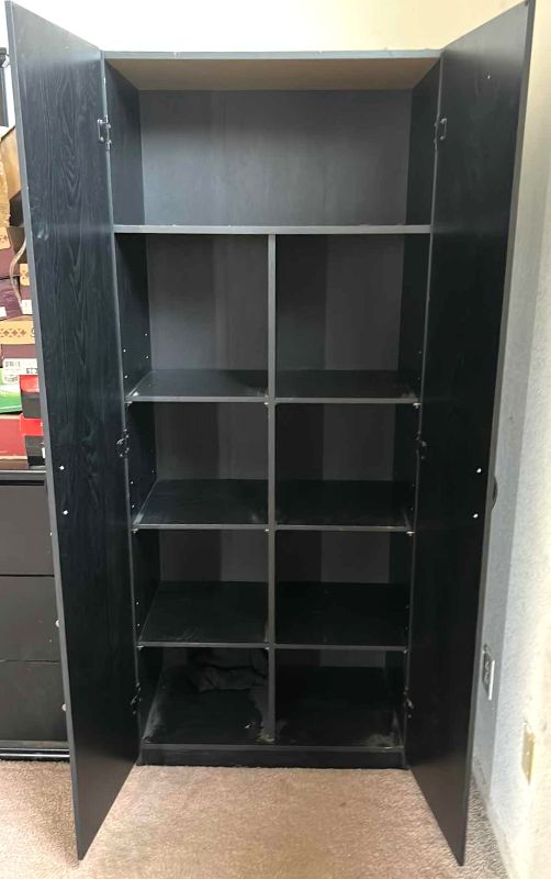 Photo 1 of STORAGE CABINET COLOR BLACK OAK 30” x 17” x 71”