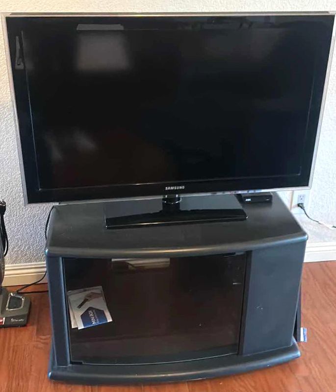Photo 1 of 44” SAMSUNG TV WITH CABINET AND MOVIES