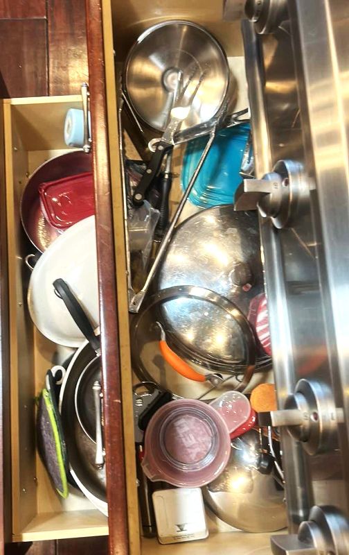 Photo 1 of CONTENTS OF 2 PULL OUT DRAWERS IN KITCHEN- POTS AND PANS
