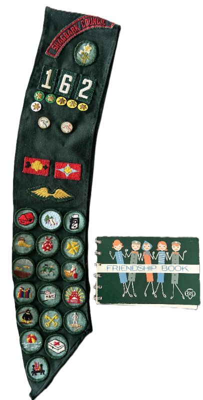 Photo 1 of VINTAGE GIRLSCOUT SASH, BADGES AND BOOK