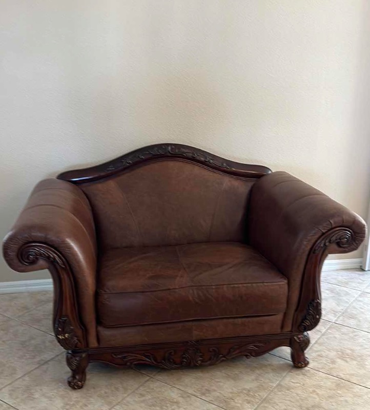 Photo 1 of BROWN LEATHER W ORNATE CHERRY TRIM OVERSIZED ARM CHAIR