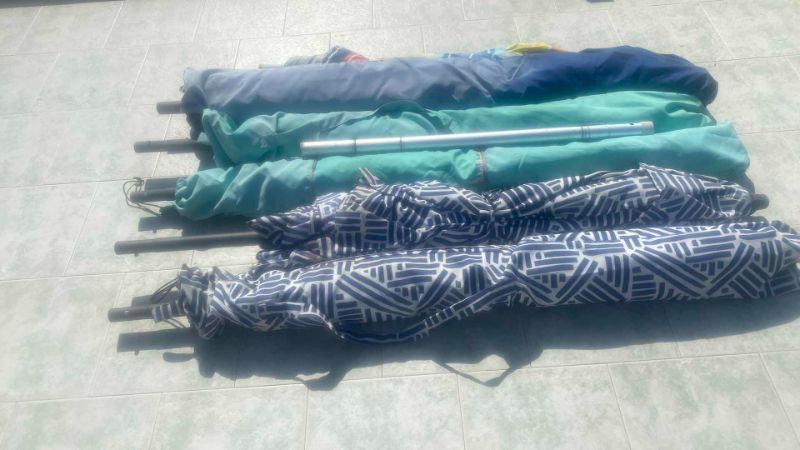 Photo 1 of 11 BLUE OUTDOOR UMBRELLAS - some bottom poles missing