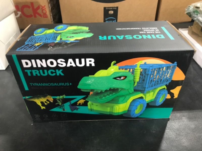 Photo 2 of TEMI Dinosaur Truck Toys for Kids 3-5 Years, Tyrannosaurus Transport Car Carrier Truck with 8 Dino Figures, Activity Play Mat, Dinosaur Eggs, Capture Jurassic Dinosaur Play Set for Boys and Girls Tyrannosaurus Dino Truck