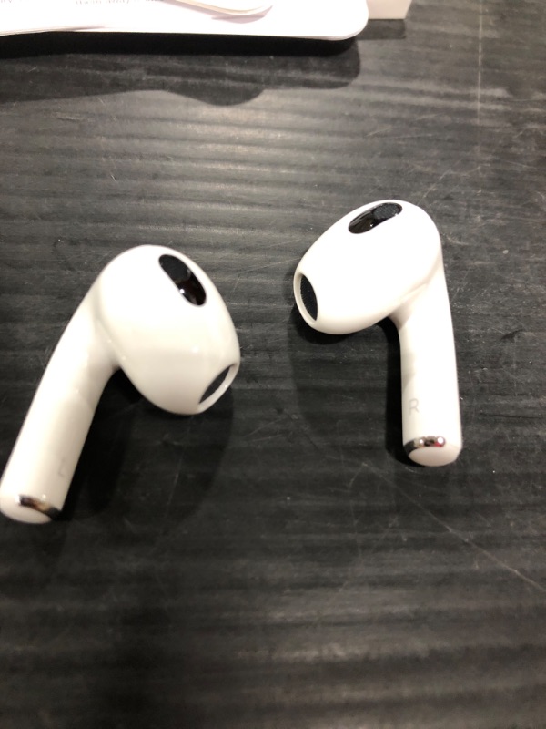 Photo 5 of Apple AirPods (3rd Generation) Wireless Ear Buds, Bluetooth Headphones, Personalized Spatial Audio, Sweat and Water Resistant, Lightning Charging Case Included, Up to 30 Hours of Battery Life Without AppleCare+