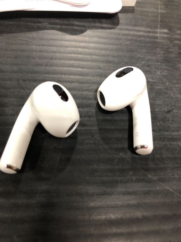 Photo 2 of Apple AirPods (3rd Generation) Wireless Ear Buds, Bluetooth Headphones, Personalized Spatial Audio, Sweat and Water Resistant, Lightning Charging Case Included, Up to 30 Hours of Battery Life Without AppleCare+