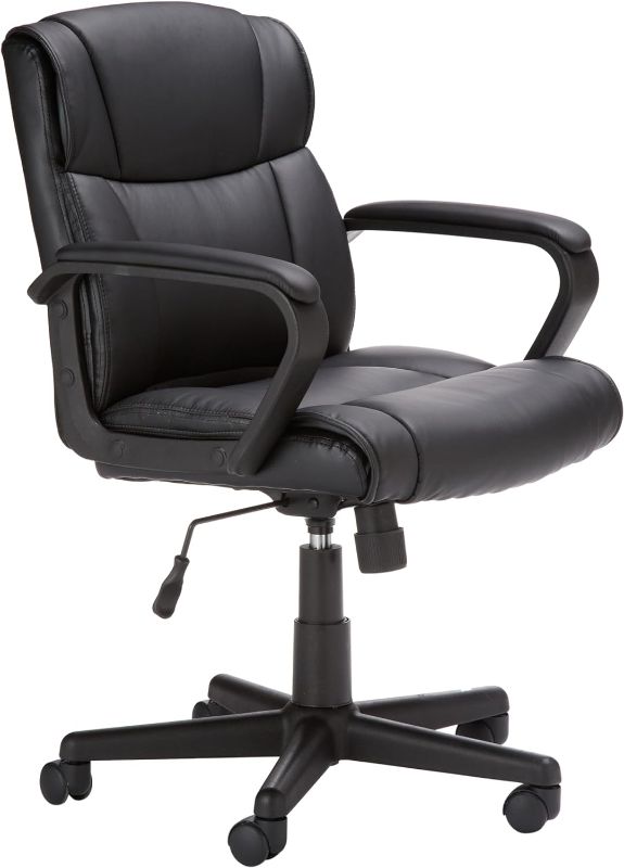 Photo 1 of Amazon Basics Office Computer Task Desk Chair with Padded Armrests, Mid-Back, Adjustable, 360 Swivel, Rolling, 275 Pound Capacity, BIFMA Certified, 24.2"D x 24"W x 34.8"H, Black Faux Leather