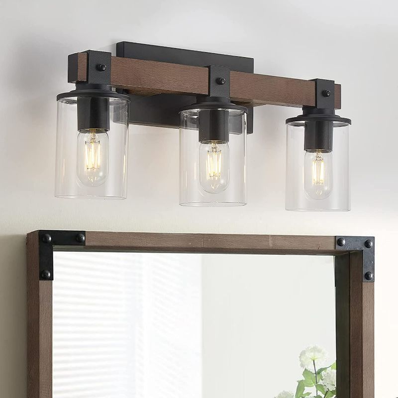 Photo 1 of DUJAHMLAND Wood Farmhouse Vanity Light,3-Light Rustic Bathroom Light Fixture with Clear Glass Shade,Industrial Black Wall Sconce for Bathroom Lighting, (Wood, 3-Light)
