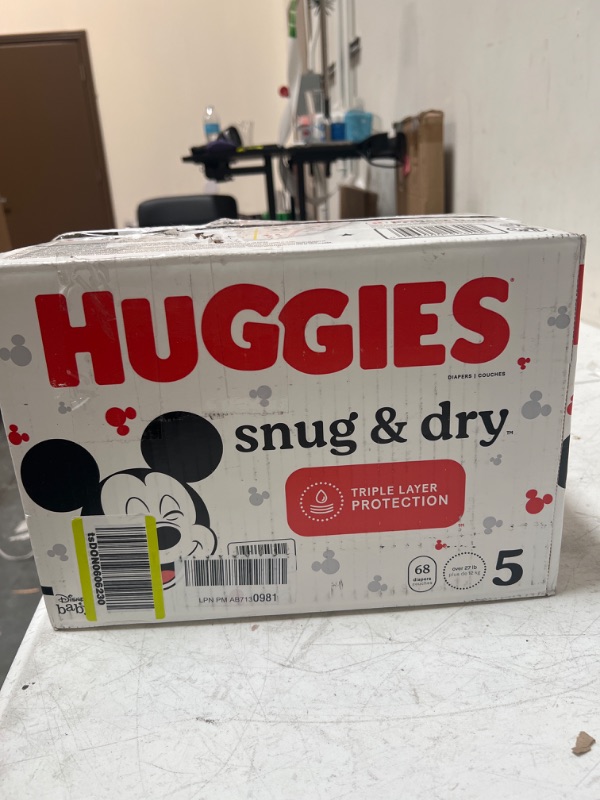 Photo 2 of Huggies Snug & Dry Baby Diapers, Size 5 (27+ lbs), 68 Ct Size 5 (68 Count)