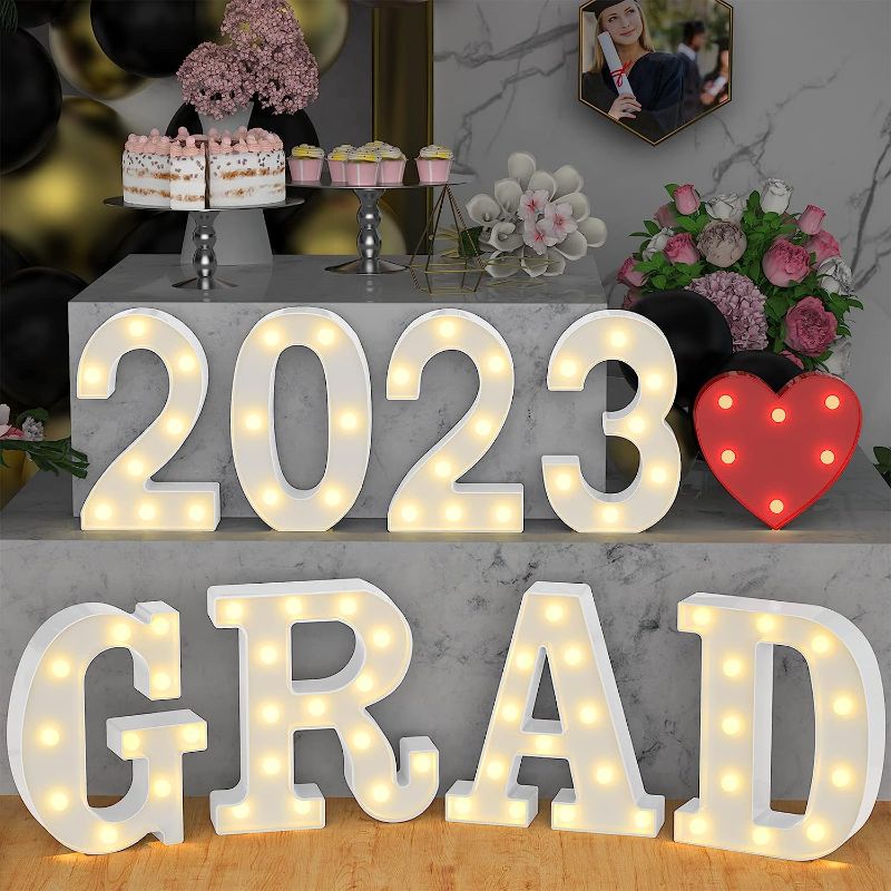 Photo 1 of Atronor Graduation Party Decorations 2023-8 LED Long Marquee Light Up Letters 'Grad 2023' and 1 'Love' - Graduation Party Decor for Kindergarten Preschool High School College Graduation(Warm Light)
