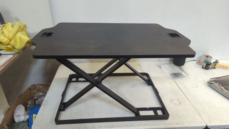 Photo 1 of SONGMICS Standing Desk, Height Adjustable Sit-stand Workstation Converter, Lightweight Stand Up Desk, for Computer, Laptop and Office Supply, Black LSD02BK
