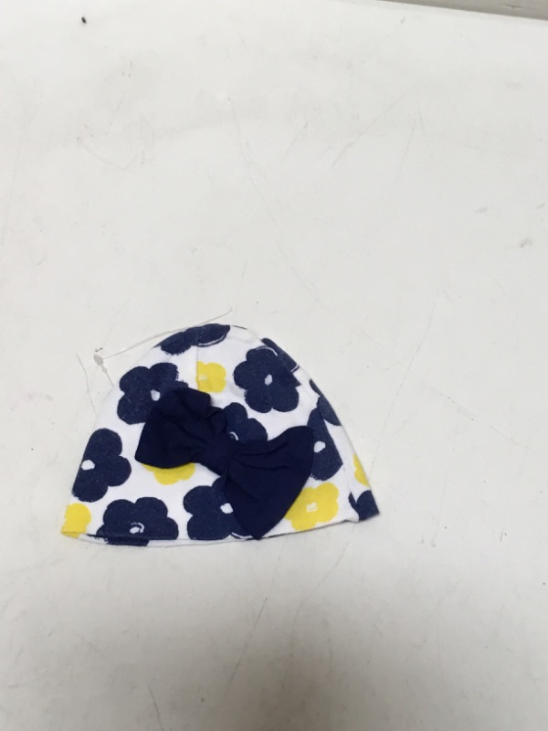 Photo 1 of infant hat with blue and yellow flowers