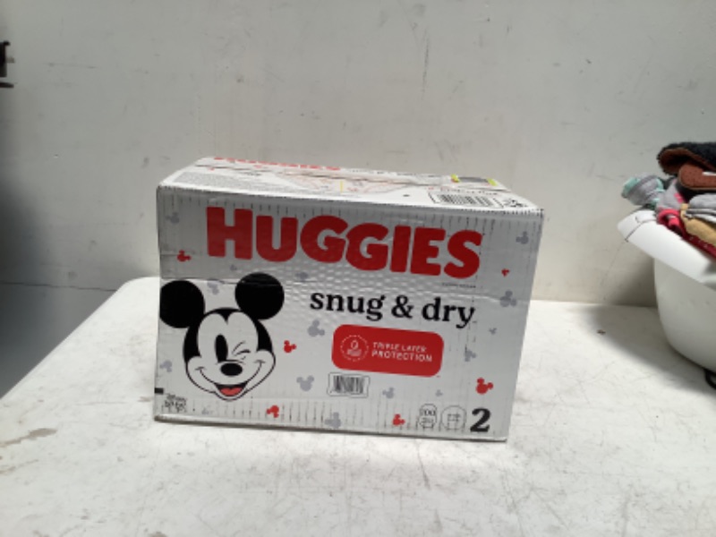 Photo 2 of Huggies Snug & Dry Baby Diapers, Size 2 (12-18 lbs), 100 Ct Size 2 (100 Count)