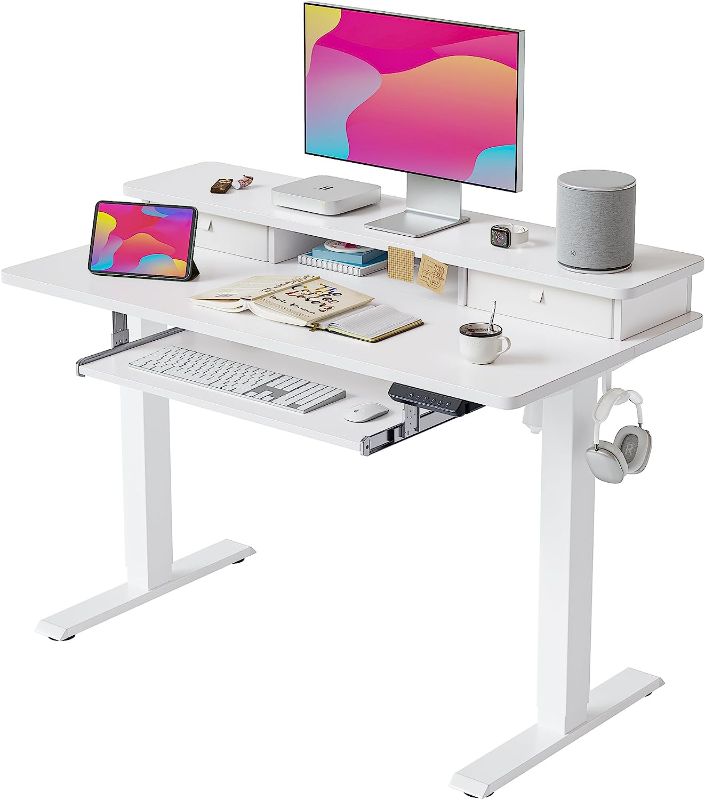 Photo 1 of FEZIBO Height Adjustable Electric Standing Desk with Keyboard Tray, 48 x 24 Inch Stand Up Table with Storage Shelf, Sit Stand Desk, White Top