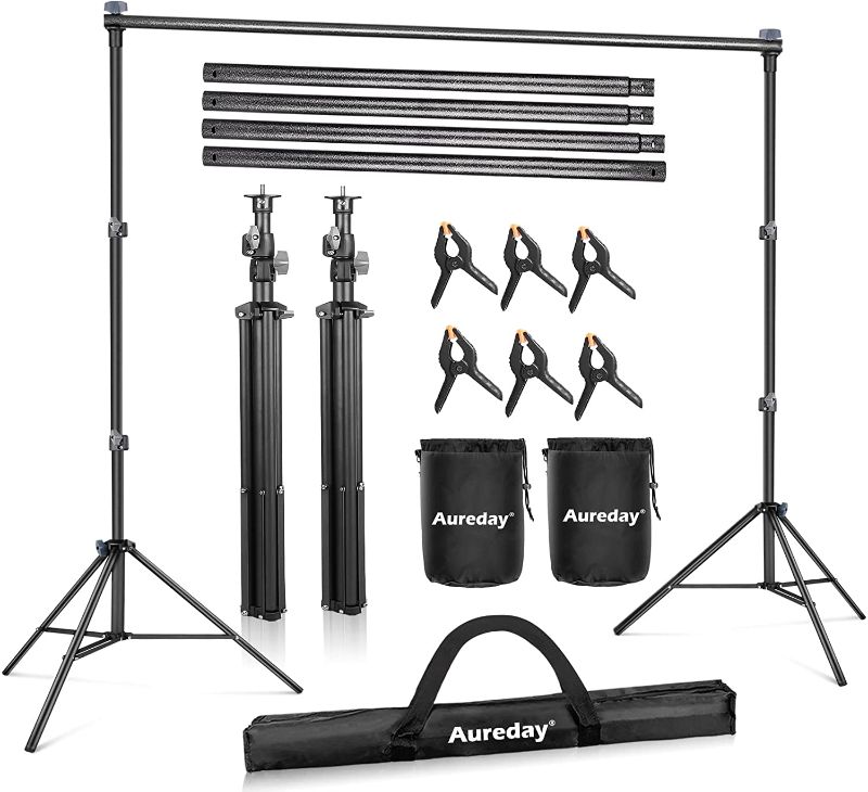 Photo 1 of Aureday Backdrop Stand, 10FT Adjustable Photo Backdrop Stand for Parties, Heavy Duty Background Stand with Travel Bag, 6 Backdrop Clamps, 4 Crossbars, 2 Sandbags for Wedding/Decorations/Photoshoot
