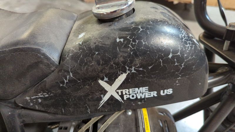 Photo 2 of xtreme power us mini bike Black 

*Pull Cord Stuck
*Rear Break Seized
*Has Gas In Tank
*Outside Paint has Gas Corrosion  